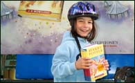 Eldest proudly posing with newly acquired book 5